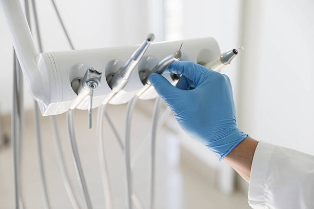 Professional Invisalign Clear Aligners technician working in Saddle Rock, NY